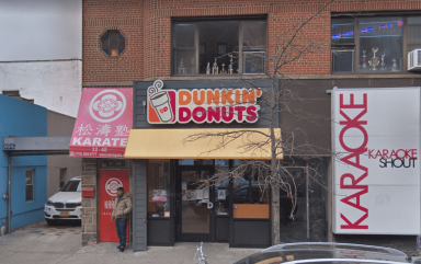 The Dunkin shop at 32-48 Steinway St. was robbed at knifepoint on April 11.