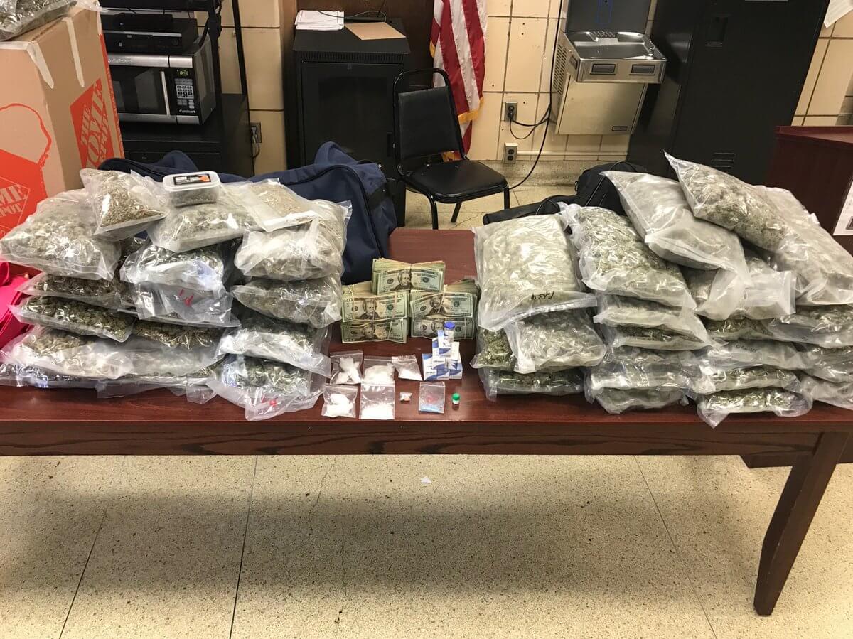 Numerous bags of marijuana and drugs, along with $37,000 in cash, seized from a Flushing home on June 1.