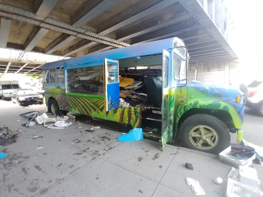 A man was found dead inside of this bus parked on a Jamaica street on July 5.