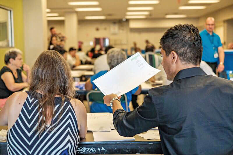 Workers sorting ballots in Middle Village on July 9 at the start of the Queens DA Democratic primary recount.