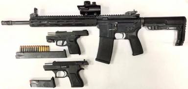 The imitation assault rifle, two handguns and bullets recovered from a St. Albans home during an Aug. 16 police raid.