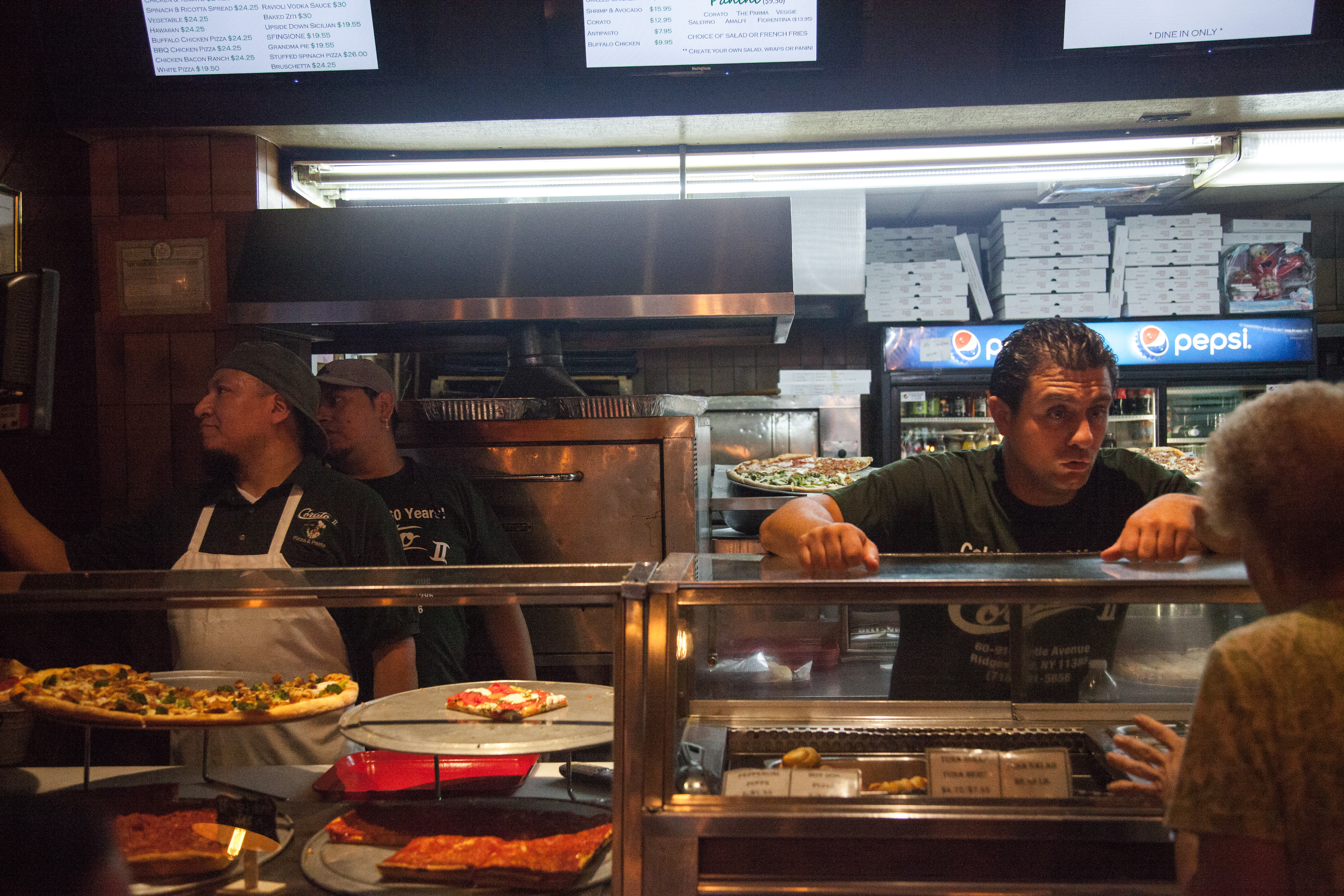 Marco Cerbone Jr. takes a customer's order at the satellite location of Corato Pizza.