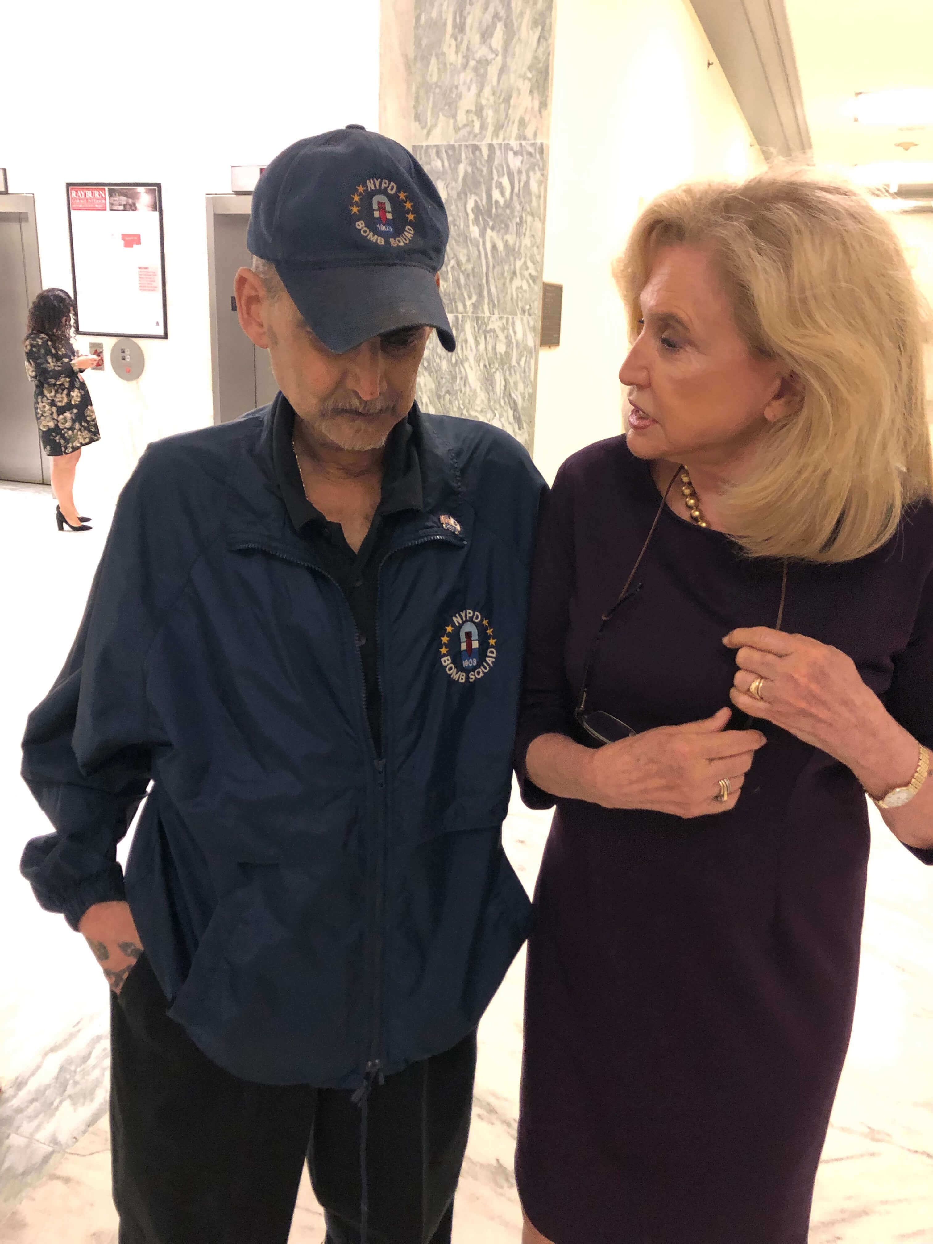Congresswoman Carolyn Maloney (right) with the late Detective Luis Alvarez, a staunch advocate of the extension of the 9/11 Victims Compensation Fund. Maloney helped write the bill that Congress passed, but was apparently excluded from the July 29 White House ceremony where President Trump signed it into law.