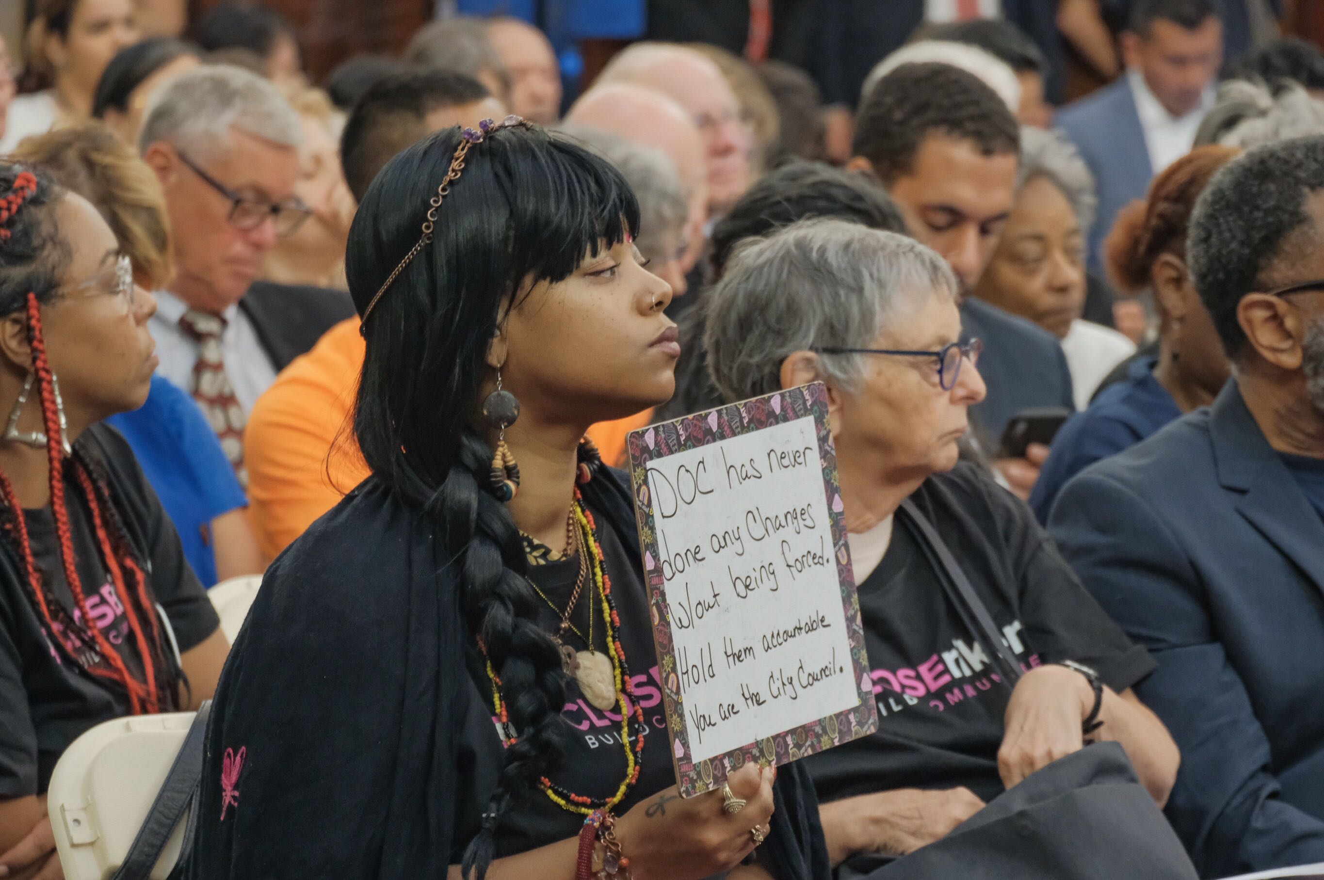 An activist at a Sept. 5 City Hall hearing on borough-based jails.