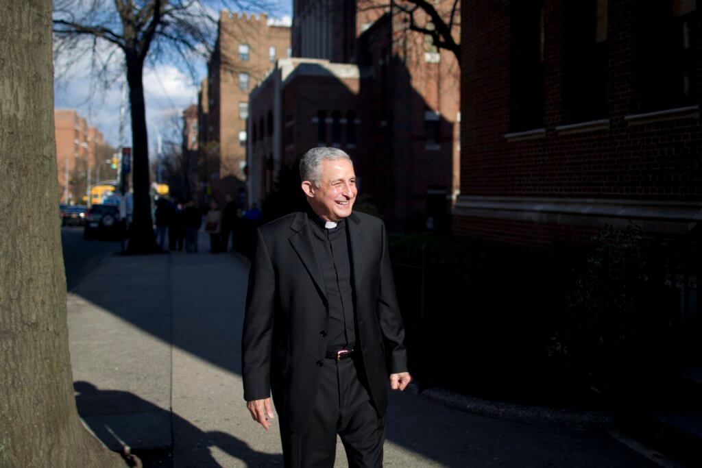 Monsignor Otto Garcia is shown in this 2013 New York Daily News photo outside St. Joan of Arc Church in Jackson Heights.