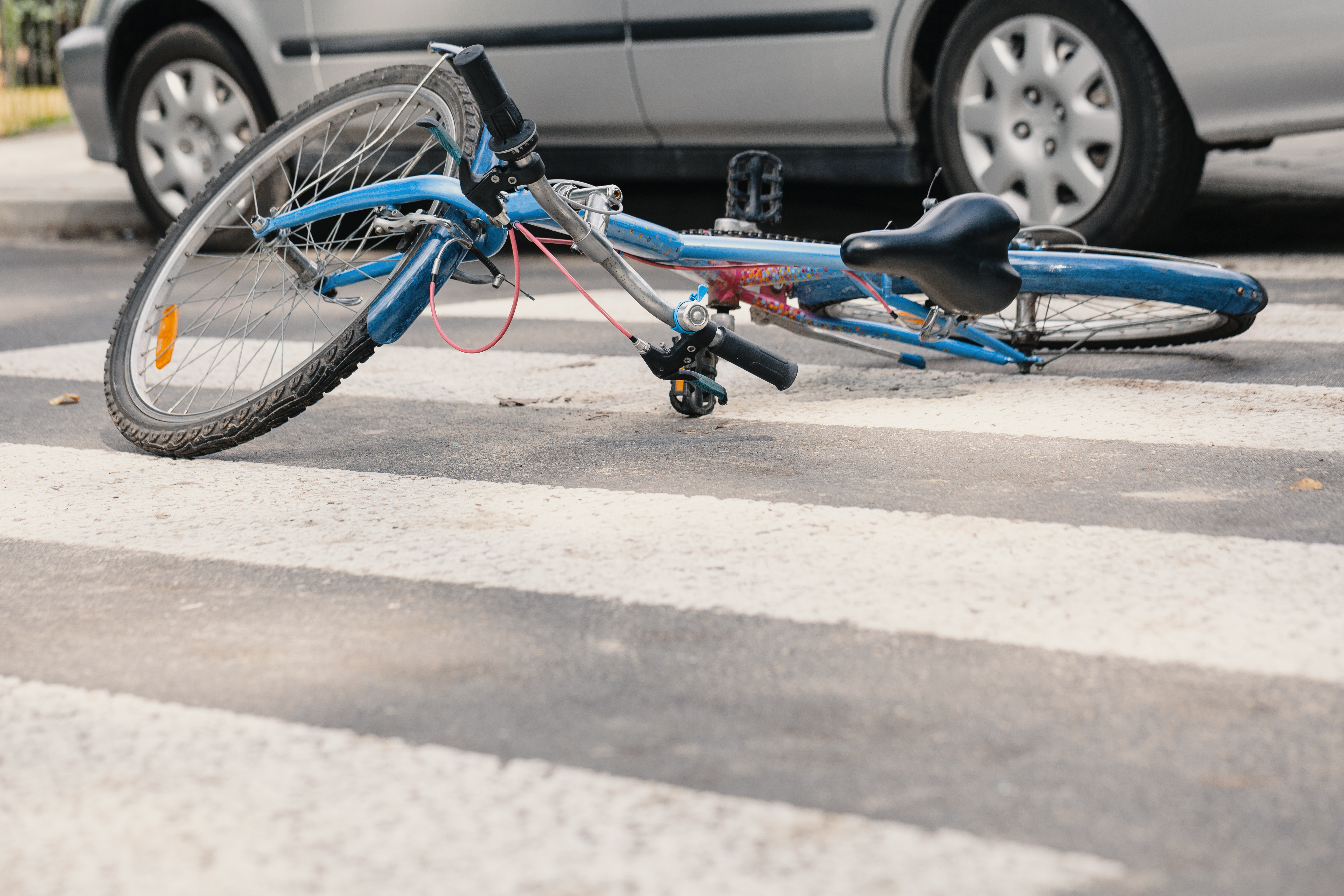 Blue bike on a pedestrian crossing after fatal incident with a car
