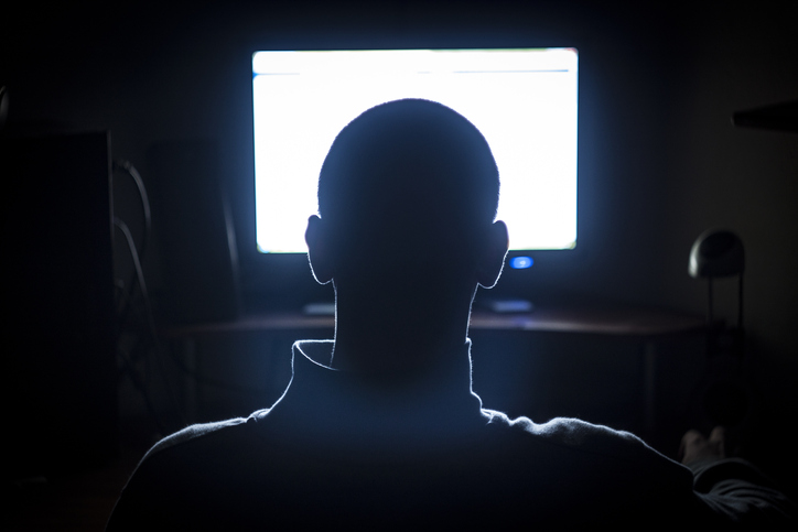 Young Adult Man in Front of Computer Monitor
