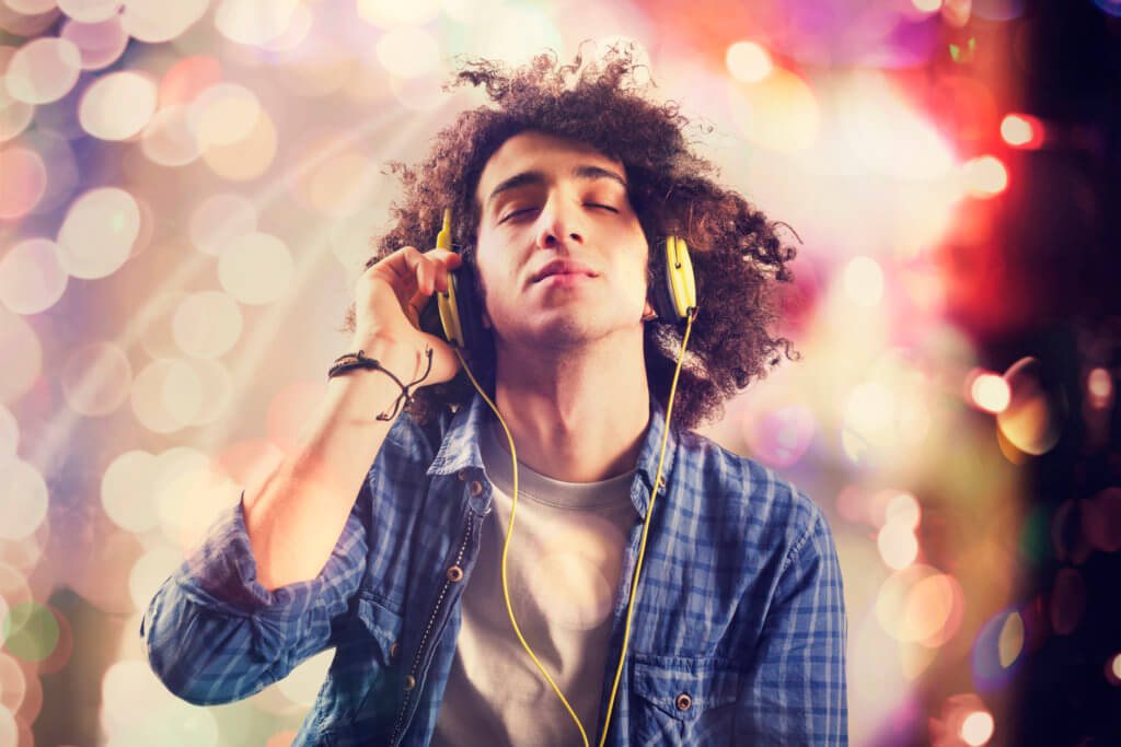 Young man listening music with headphones