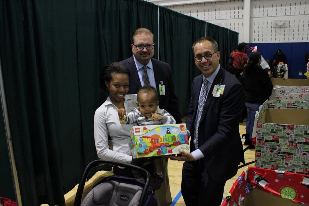 Jerry Walsh, CEO, and Donald Morrish, Chief Medical Officer, distributing gift