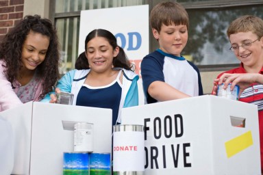 Kids volunteering at food drive