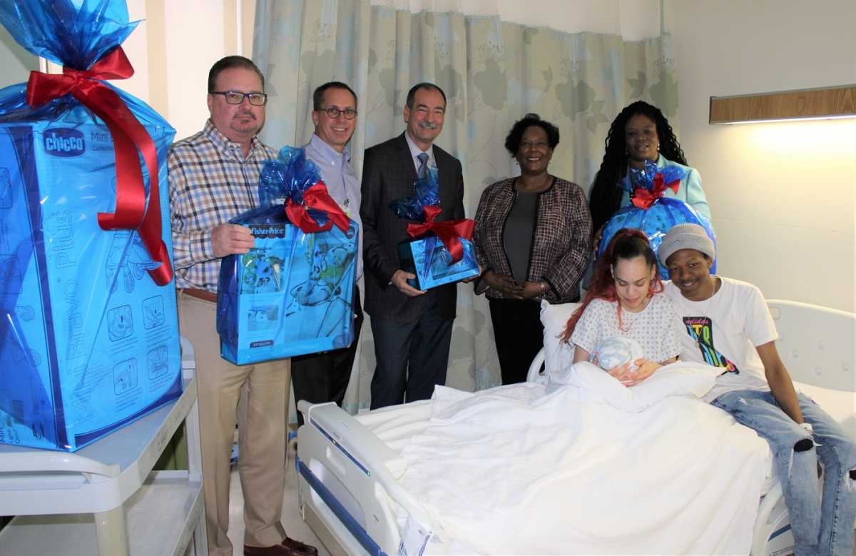 Jerry Walsh_CEO_Donald Morrish_Chief Medical Officer_Joe Caraccia_Jzanus_Gwen Pinckney_Chief Medical Officer_Denise Potts_Director of Maternal Child Health_Parents with baby Kenzo