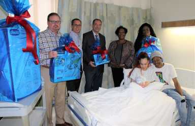 Jerry Walsh_CEO_Donald Morrish_Chief Medical Officer_Joe Caraccia_Jzanus_Gwen Pinckney_Chief Medical Officer_Denise Potts_Director of Maternal Child Health_Parents with baby Kenzo