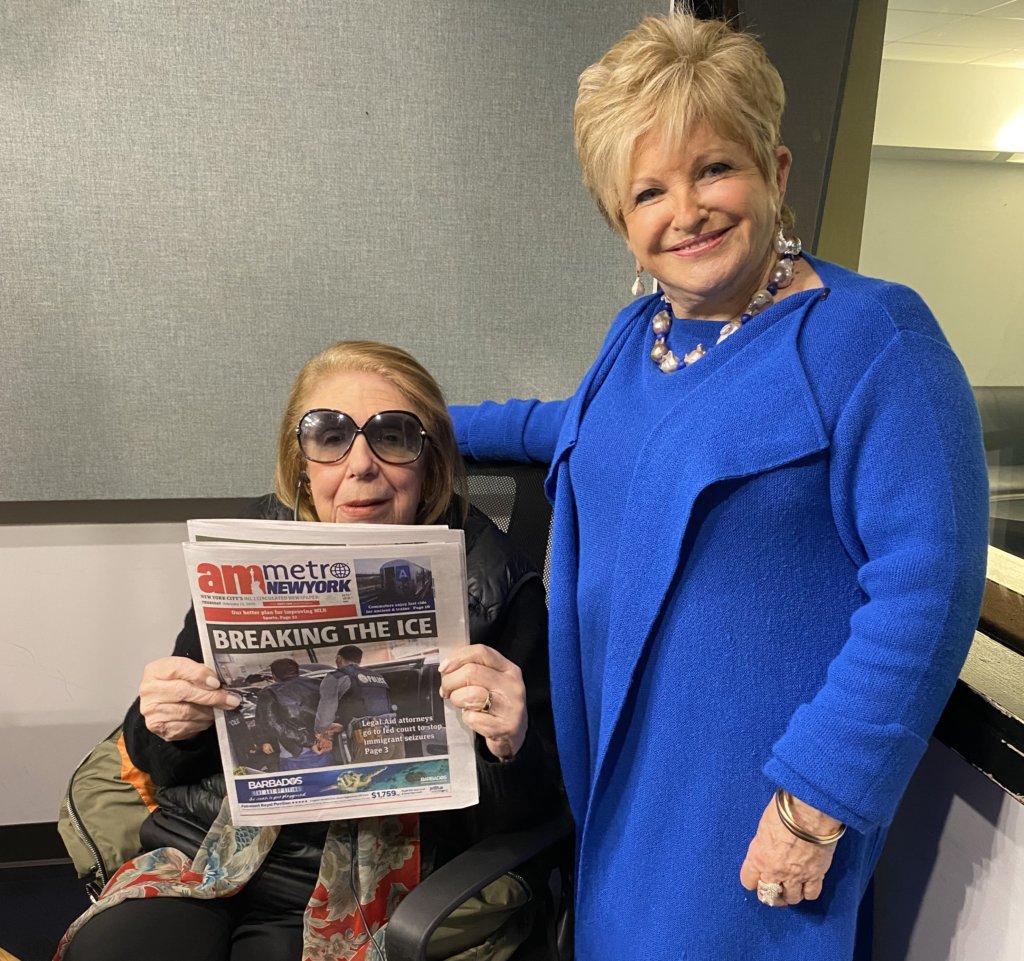 With Joan Hamburg holding up a recent edition of amNewYork Metro