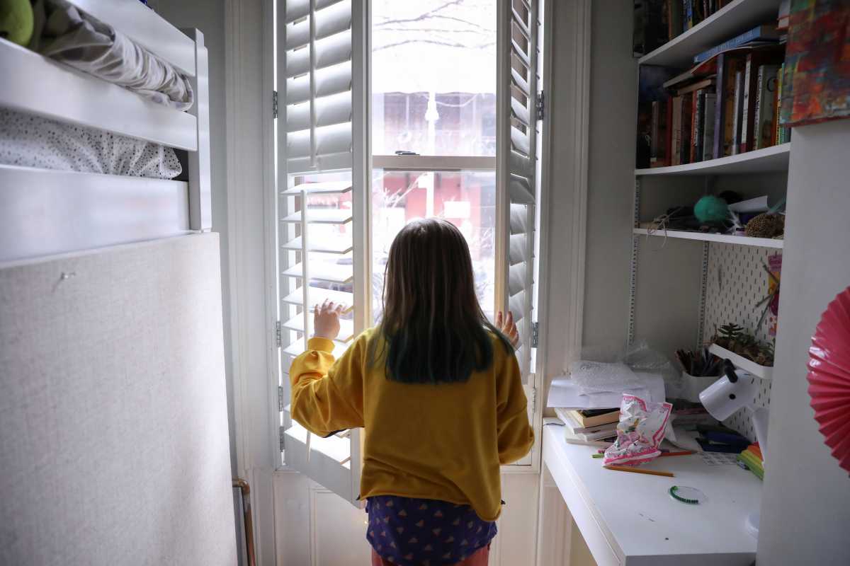 FILE PHOTO:  Naomi and her husband Doug Hassebroek work from home with their children in Brooklyn, as New York public schools statewide close due to public health concerns over the rapid spread of coronavirus