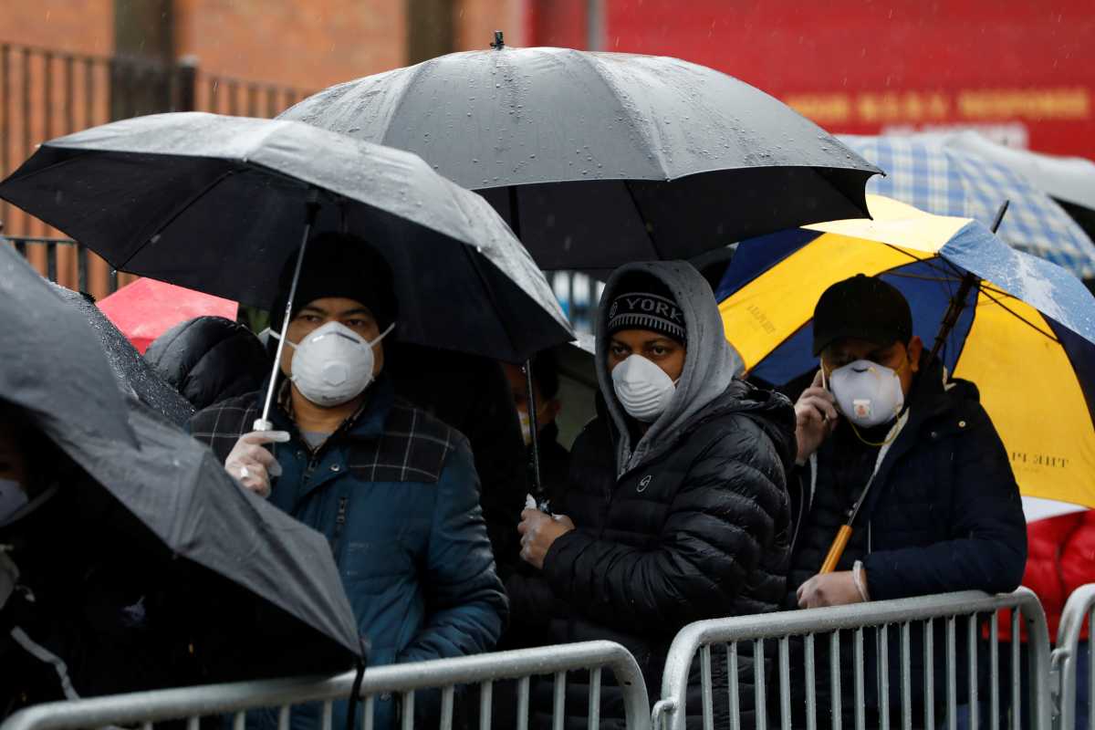 People queue at the Elmhurst Hospital Center to be tested for the coronavirus disease (COVID-19) in Queens, New York City