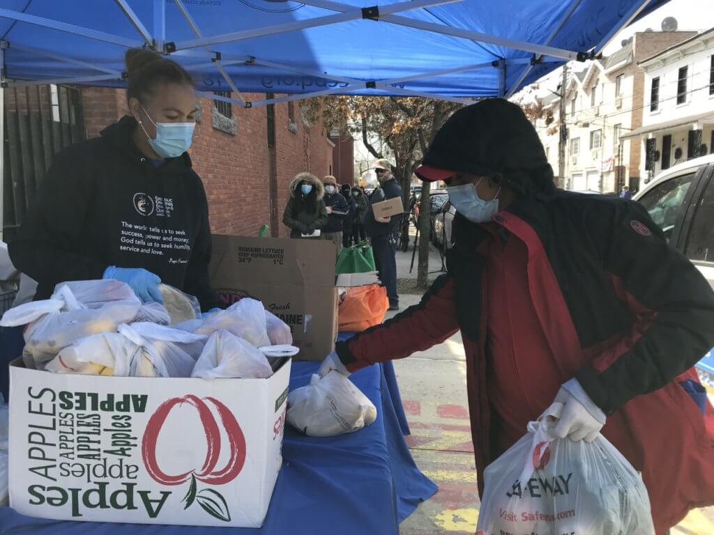 Community in Corona hit hardest by the COVIS-19 pandemic receive meals to feed their families organized by Catholic Charities Brooklyn and Queens_APR17