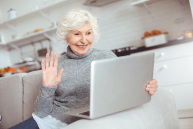 Grandma learns how to work with computer in video chat