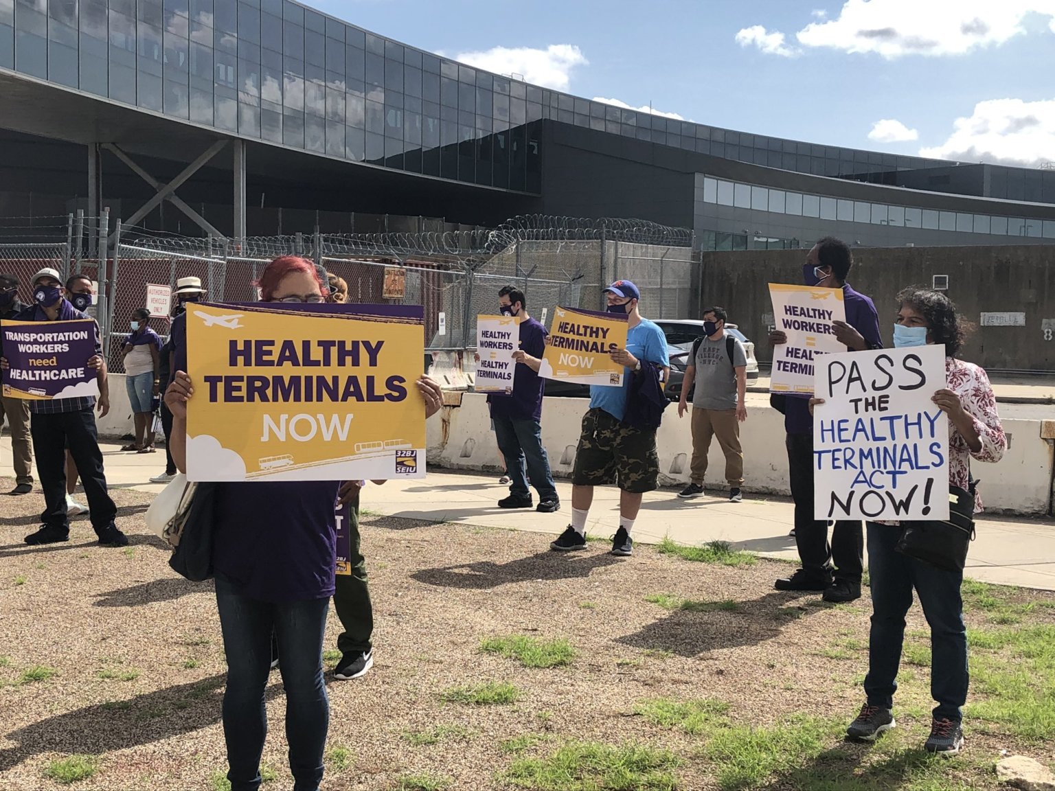 32BJ SEIU airport workers rally at JFK demanding passage