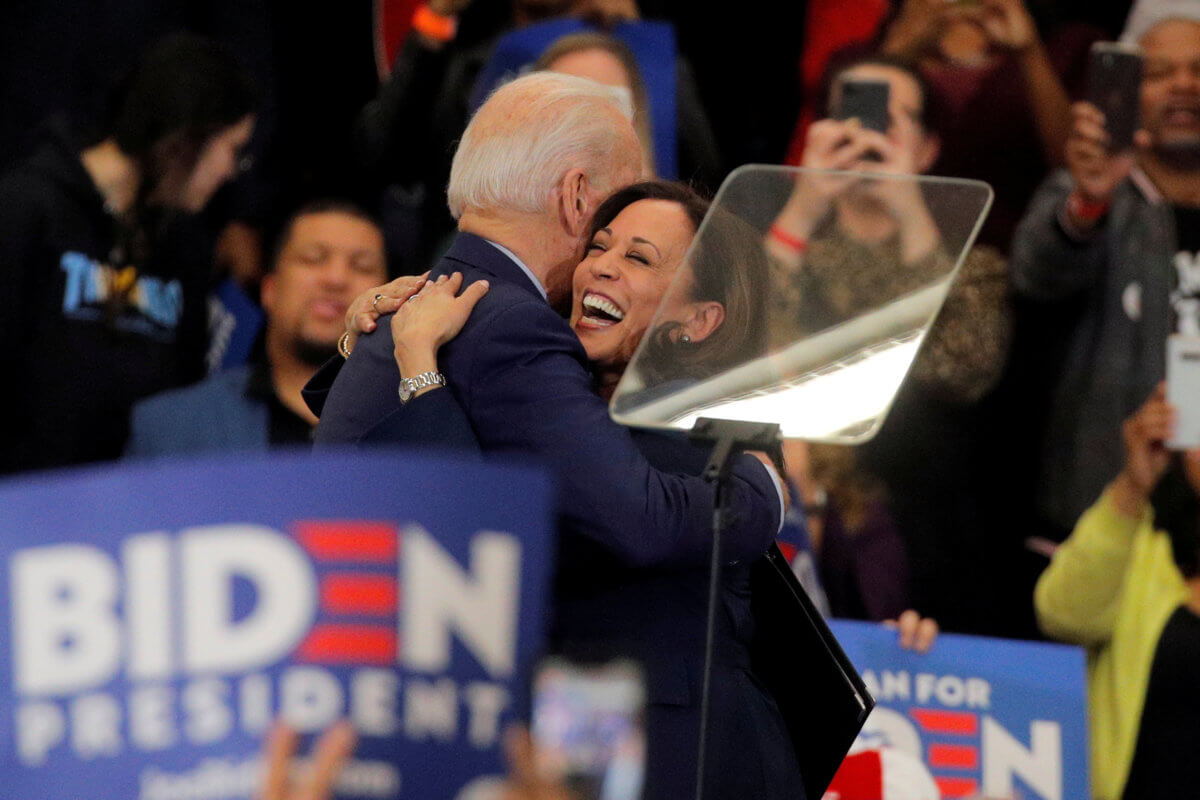 FILE PHOTO: Democratic U.S. presidential candidate and former Vice President Joe Biden is greeted by  U.S. Senator Kamala Harris during a campaign stop in Detroit, Michigan
