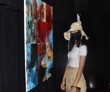 visitor pictured with _Mangos en Las Nebulosas_ by Alejandro Otaola