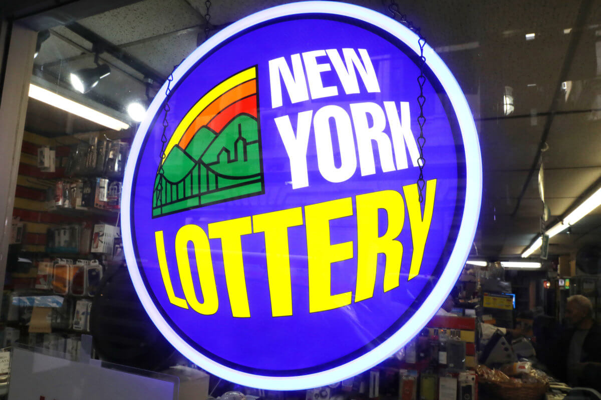 A sign displays the availability of lottery tickets at a store in midtown Manhattan in New York