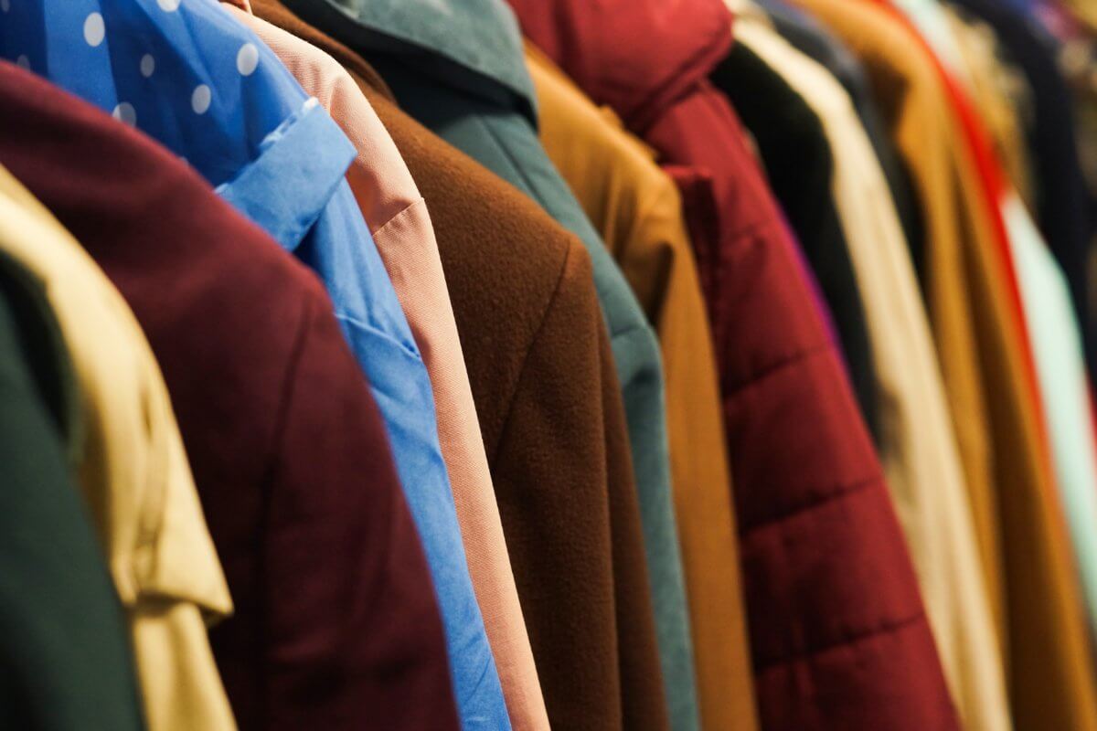 Colourful coats in the charity shop.