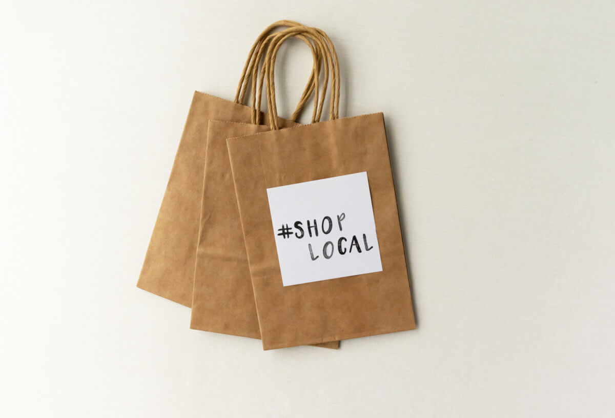 #ShopLocal stamped on a paper bag – shop local message for small retailers / businesses