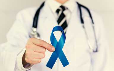Doctor Holds Blue Ribbon