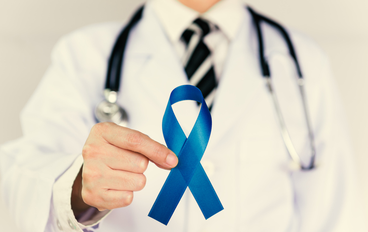 Doctor Holds Blue Ribbon