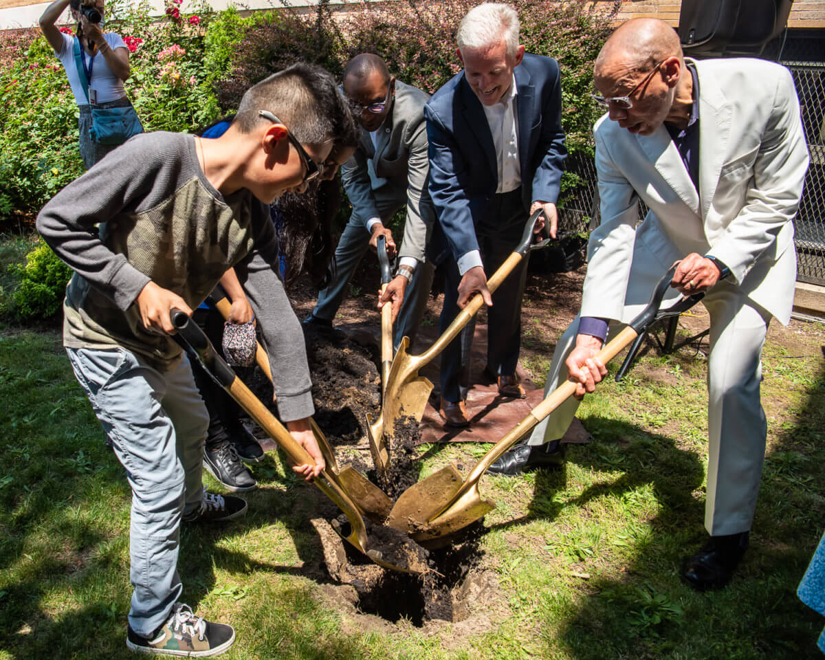 Queens Public Library, elected officials, and P.S. 171 students bury time capsule at Astoria branch