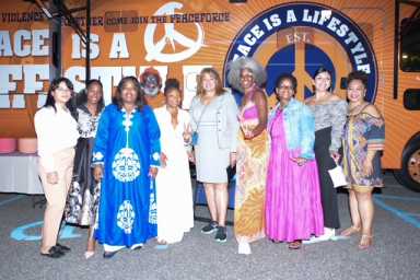 Kim Hardy and Erica Ford Founder of Life Camp flanked by teh New Termianl One Team and Life Camp Members