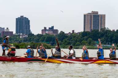The Queens Borough Hall team emerges victoriously after the race against the City Hall Dragons in the 2021 Hong Kong Dragon Boat Festival.