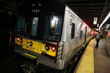 Commuters leave a Long Island Railroad train at Pennsylvania Station in New York