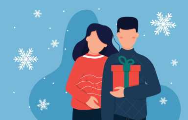 Man is giving gift to his girlfriend. Merry Christmas holiday surprise.