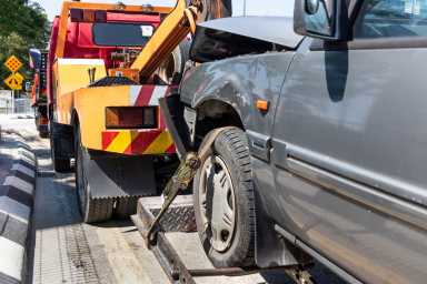 Tow Truck Towing A Broken Down Car In Emergency