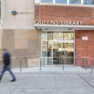 The main entrance to QPL's Steinway location. Photo via QPL.