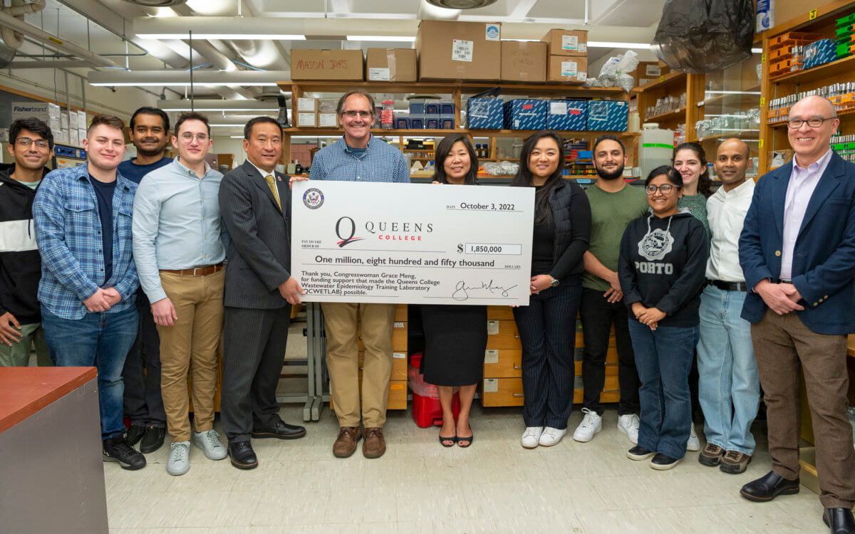 Congresswoman Grace Meng presents a check to Queens College