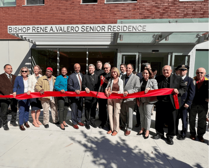 Catholic Charities Brooklyn and Queens officials cut the red ribbon at the new Bishop Rene A. Valero Senior Residence in Astoria