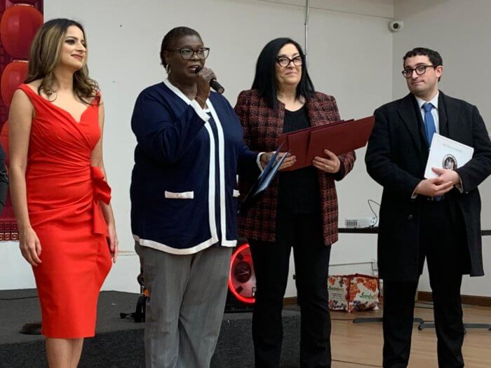 Local elected officials give remarks at the Cityline Ozone Park Civilian Patrol Lunar New Year celebration at the Deshi Center.