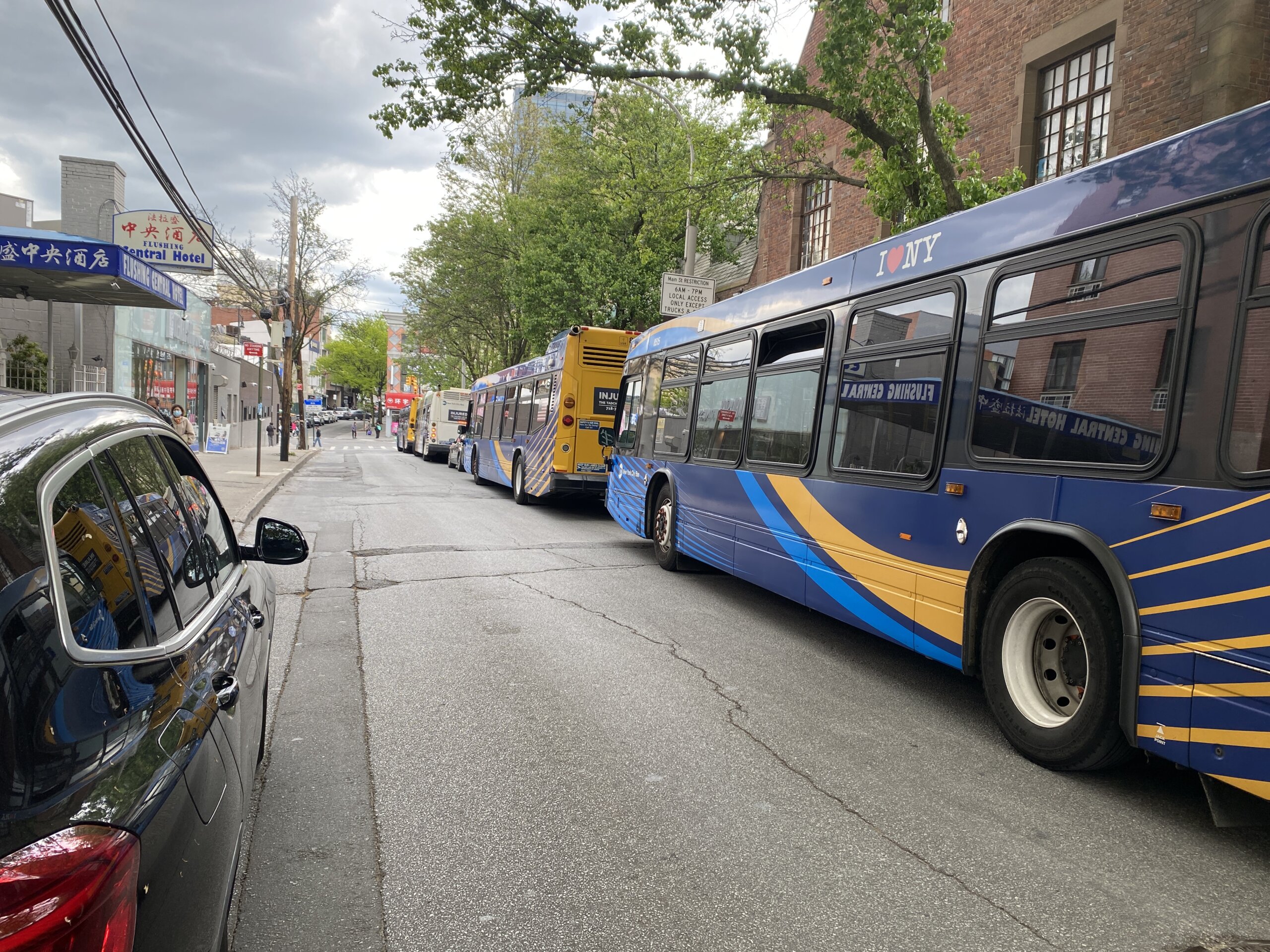 Several cars struck by MTA bus, stacked on top of each other in