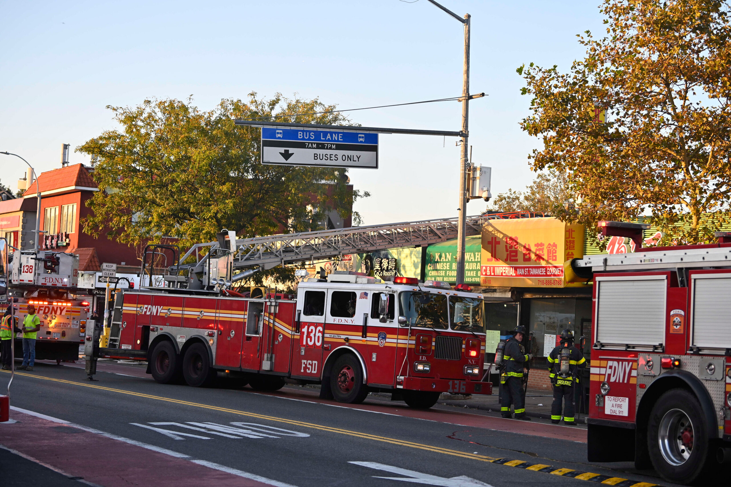 FDNY fights 2-alarm blaze on a commercial strip on Main Street in
