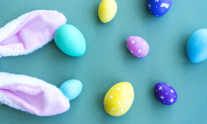 Easter composition. Multicolored Easter eggs and bunny ears