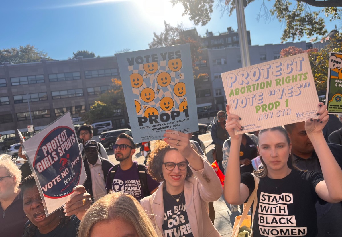 Local leaders and advocates rally at Queens Borough Hall in support of Proposition 1, amid vocal opposition