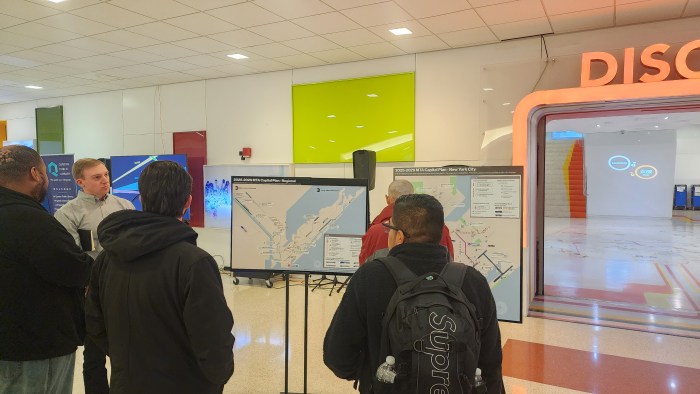 Members of the public speak to an MTA official during Wednesday's open house for the 2025-29 Capital Plan. Photo: Shane O'Brien