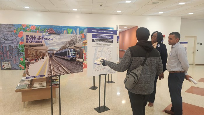 A Member of the public speaks to an MTA official during Wednesday's open house for the 2025-29 Capital Plan. Photo: Shane O'Brien