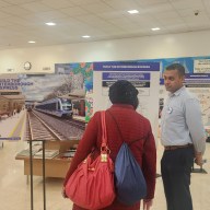 A member of the public speaks to an MTA official about the Interborough Express as part of Wednesday's open house for the 2025-29 Capital Plan. Photo: Shane O'Brien