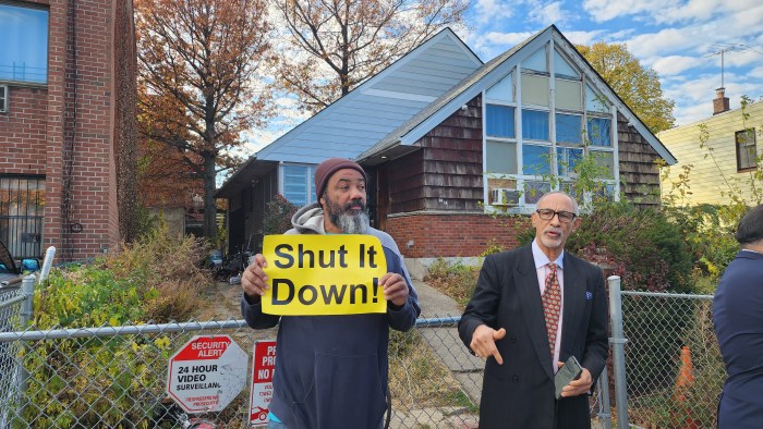 Activists outside an alleged brothel in Corona on Tuesday. Photo: Shane O'Brien