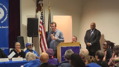 Michael Sullivan, chief of staff to Steve Cohen, delivers a Metropolitan Park presentation to CB 3 on Thursday night. Photo: Shane O'Brien