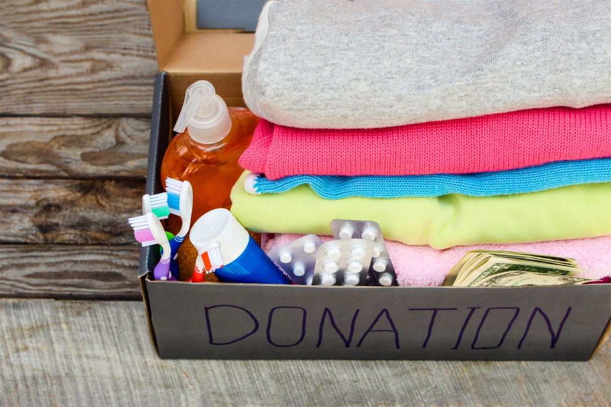 Donation box with clothes, medication, living essentials and money