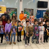 Students at PS 24 pose with their new toys following last week's giveaway. Photo: Office of Council Member Sandra Ung.